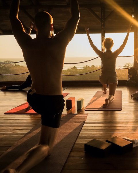 Yoga practitioners at sunset, Costa Rica
